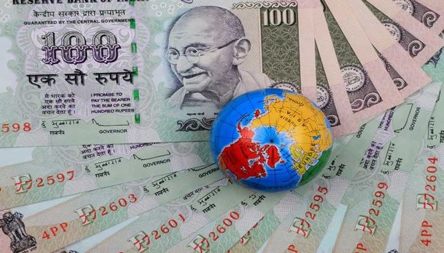 Indiam money bills and a globe