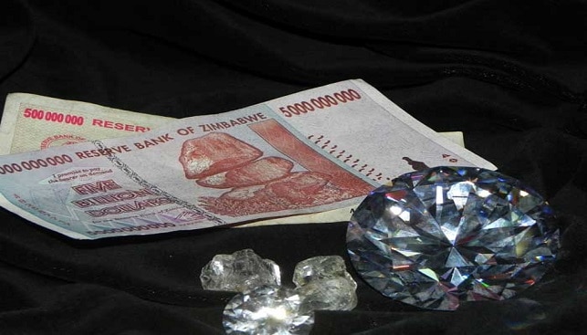 Zimbabwe money and a Rough Polishd Diamond