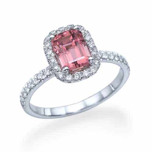 Platinum engagement ring set with round diamonds and a yellow tourmaline stone