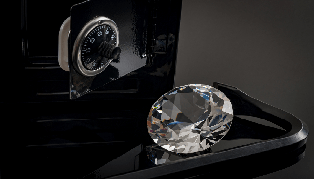 A diamond outside a opened safety box or safe