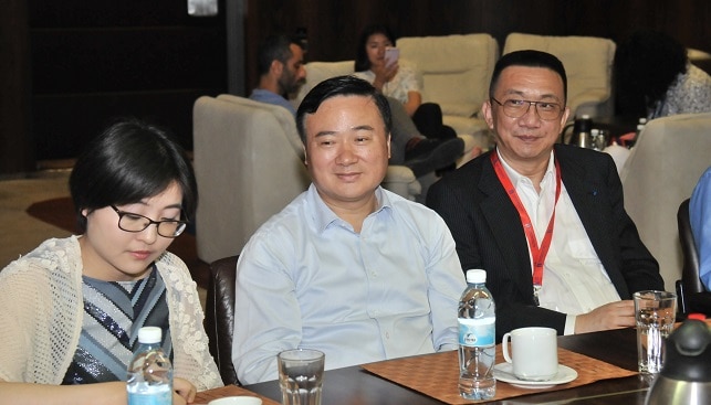 Right to left: Lin Qiang, President of the Shanghai Diamond Exchange. Weng Zuliang, Party Secretary for the Pudong District and VP for the Free Trade Zone in Shanghai; Weng Zuliang, Party Secretary for the Pudong District and VP for the Free Trade Zone in Shanghai; and the translator