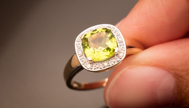 green peridot gemstone ring