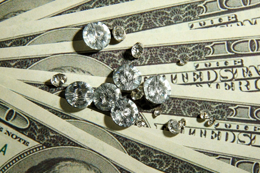 Polished diamonds on dollars