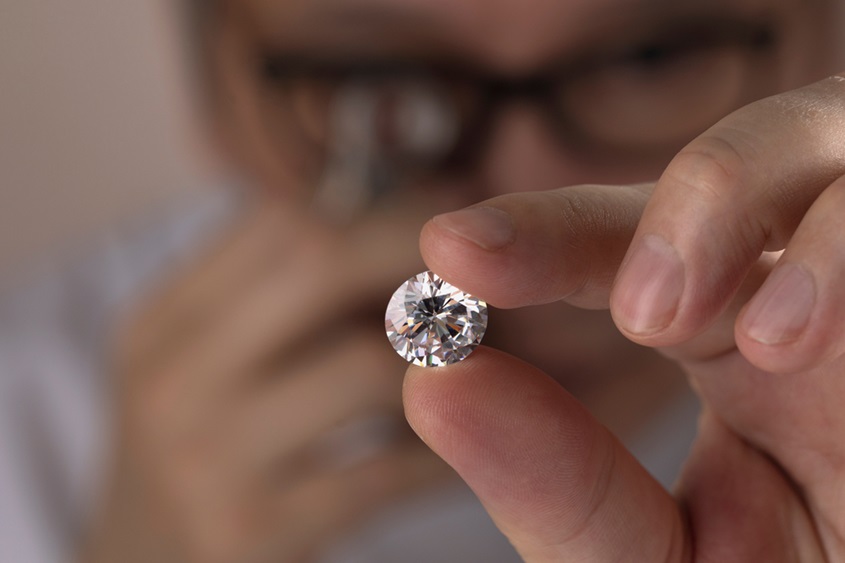 Asian,Man,Expert,Buyer,With,Glasses,Evaluates,Polished,Diamond,Trough